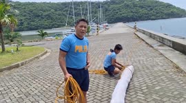 Philippine Coast Guard and police deploy booms as oil spill nears coast