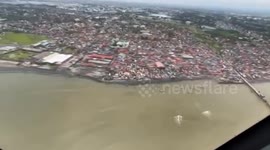 Aerial survey of oil spill shows darkened shores along Manila Bay in the Philippines