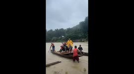 Filipinos exhibit 'BAYANIHAN' helping delivery rider cross Tinipak River in Tanay, Philippines