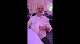 Man man uses a matching tie to hide too-tight shirt at dinner