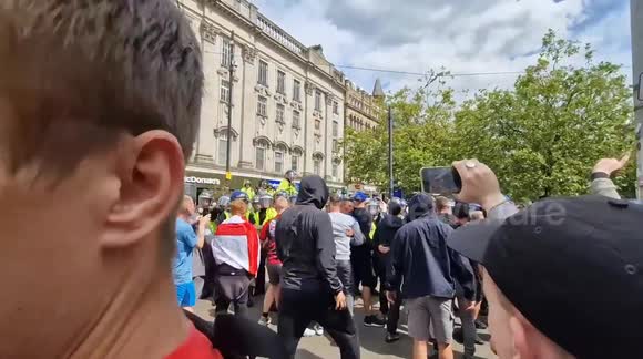 Chaos as 'Enough is enough' protest fights with police on piccadilly gardens, in Manchester
