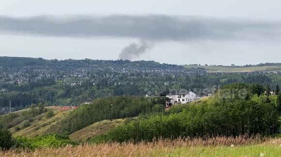 Large Smoke Cloud Forms From House Fire Burning in Springbank Area of Calgary.