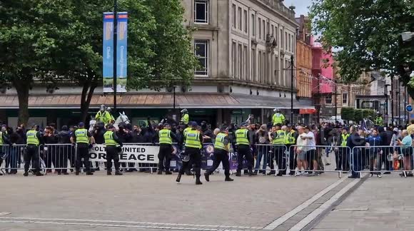 Masked counter protest shows up on mass as riot police deployed at Bolton enough is enough protest outside the town hall