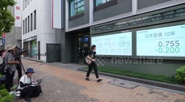 Japan's Nikkei closes 12.4 pct lower in record intraday plunge