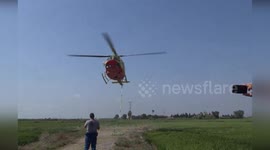 Spain: Helicopter Lifted by Another Aircraft After Collision with Power Lines in Alfafar