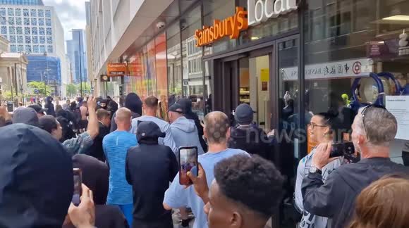 Man stops far-right protesters from entering Sainsbury's store before police step in