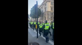 Police charge towards racist riots in London near 10 Downing Street