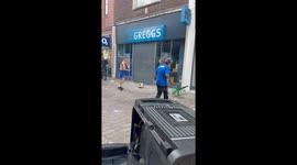 Shocking scenes as far-right use chairs in attempt to smash way into Greggs