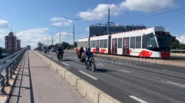Bikers ride the viaduct and greet