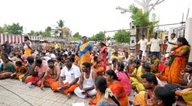 Devotees Have Coconuts Broken Over Their Heads by a priest to Please Deities