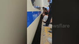 Child rescued after falling in gap between train and platform