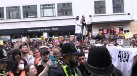 Protesters in Brighton shout and display 