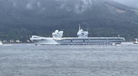 Aircraft carrier HMS Prince of Wales leaving Loch Long in Argyll Scotland