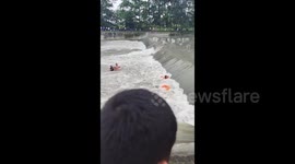 China: A man washed to the rolling water dam while swimming in Chengdu