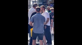 Tension as thief steals from street performer and passer-by confronts the thief