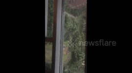 China:  The oversized Inflatable Doll of a character from the game Eggy Party was blown into a residential building during the storm