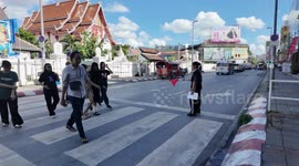 Thailand Teachers Waving Red Flags at a Zebra Crossing in Chiang Mai