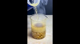 Volatile experiment as 1,000 degree Celsius metal ball dropped onto popcorn AND Redbull