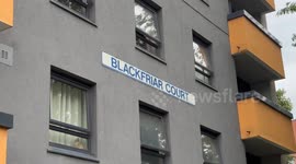 Two people arrested after a man died falling from fourth floor balcony