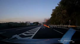 Car erupts in flames on Chinese highway, creating 100-metre fire trail