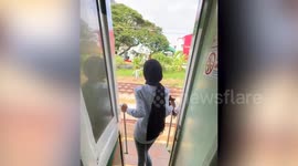 Tourist, 19, posing for video hanging from train door hits head on metal post