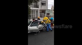 Hilarious moment when clowns and a bootleg Minion rescue stranded car in Argentina
