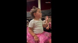 Little girl's laughter and joy as 'Pinky Ponk' lands at night garden show