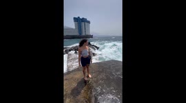 Wave Sweeps Girl Off Her Feet