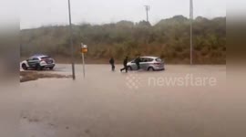 Spain: Family Rescued from Vehicle Trapped by Floodwaters in Alaior