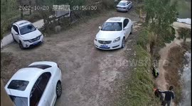 China: Сar slides down the shore into water in Xiaogan