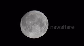 The August Full Moon known as the Sturgeon Moon high in the sky