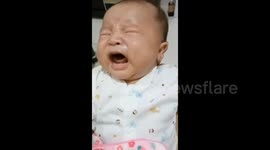 Baby frightened by his own farts