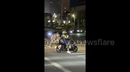 China: Delivery man rides along with little dog in Guiyang