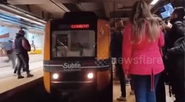 Man crosses in front of the metro in Buenos Aires