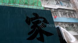 Life in Kowloon, Hong Kong, as Residents Navigate Daily Life Visit Food Markets Under Heavy Summer Rainstorm