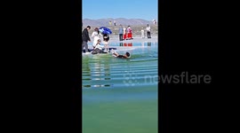 Chinese tourist rescued after dangerous slip into lake while taking photos