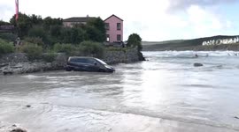 High tide at Polzeath floods family car