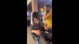 Man in agony as he gets ears, nostrils, and face waxed at barbershop