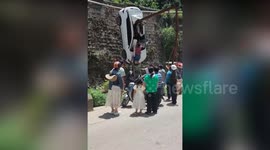 Woman survives after car impaled on massive girder