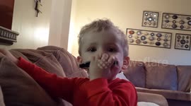 A 1-year-old wows everyone with his impressive harmonica skills, showcasing a surprising talent at such a young age.