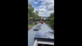 'Comedic Bridge Jump Fail' - Man misses boat and ends up hanging