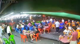 Chinese diners flee as fierce winds toss outdoor restaurant furniture across road