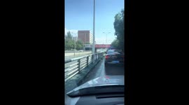 Car mimics submarine as it tackles flooded road in China