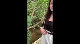 Give me back my stream! Snake swims through water where tourists set up tables