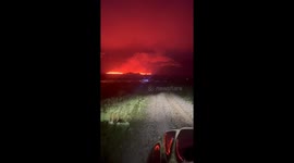 Erupting volcano in Iceland turns night sky red in breathtaking footage