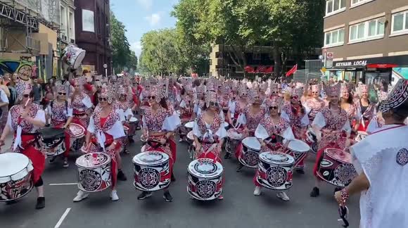 Stunning costumes and samba as the Notting Hill Carnival Parade passes through the famous London neighbourhood