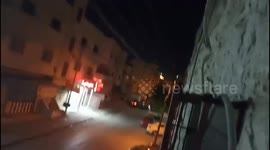 Palestine: An Israeli Soldier throws stun grenades into a family car in Hebron