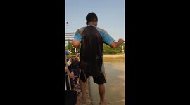 Participant falls into water during tightrope walking race in West Java, Indonesia