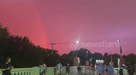 Dramatic Red Sky with Lightning and a Rainbow