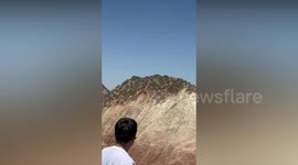 Incredible moment mountain goats speed up and down mountainside as if they are flying